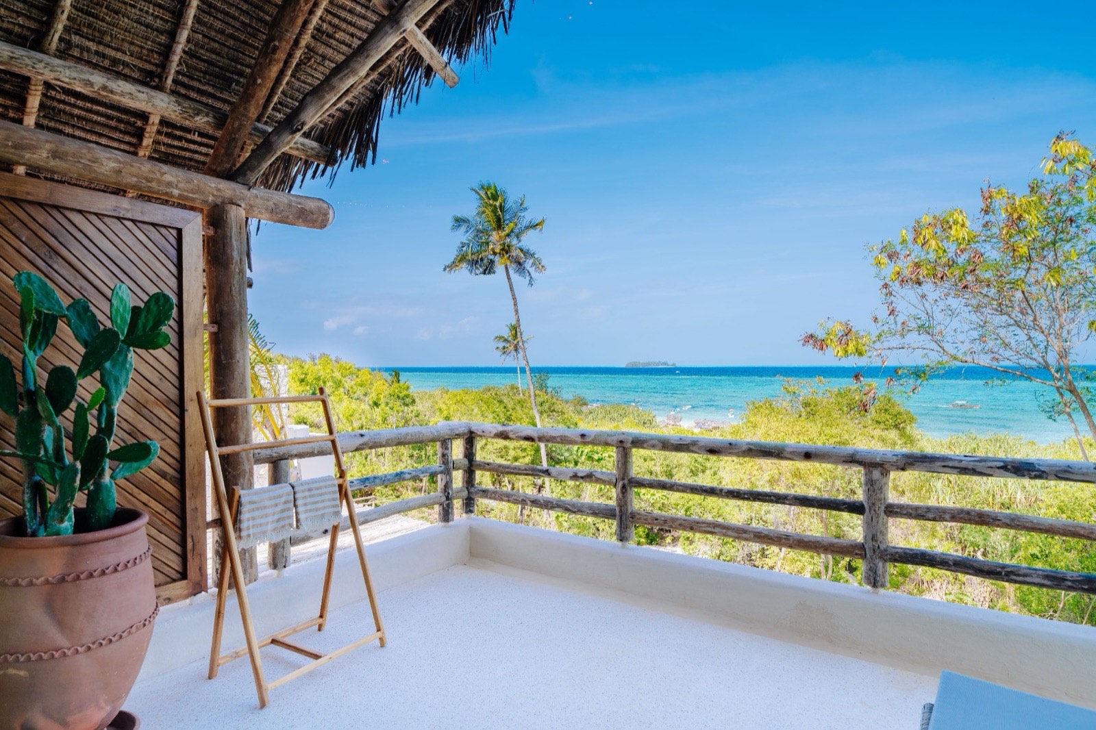 Beach Retreat Villa terrace looking over the lagoon toward Mnemba