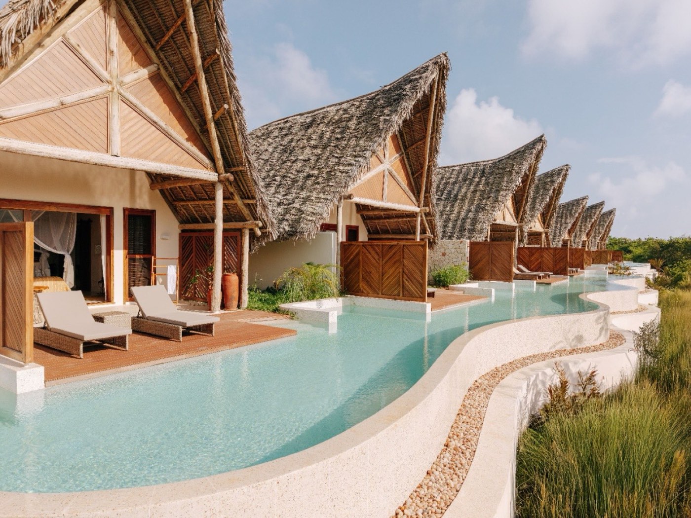 Swim Up Villas along the shared infinity channel