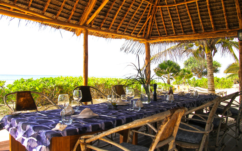 The long table under the thatch at Villa Turquoise, set for the group